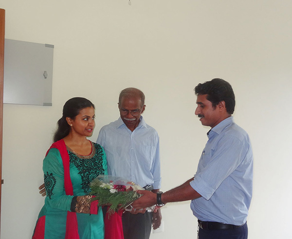 Our project Engineer greeting Ms.Swapna Praveen of apartment D 7, Crescent Iris during handing over ceremony.