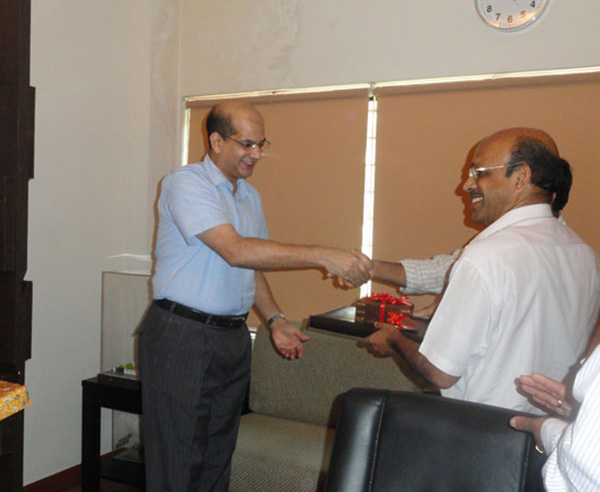 Keys being handed over to Mr. N P Rajan of apartment no A 7