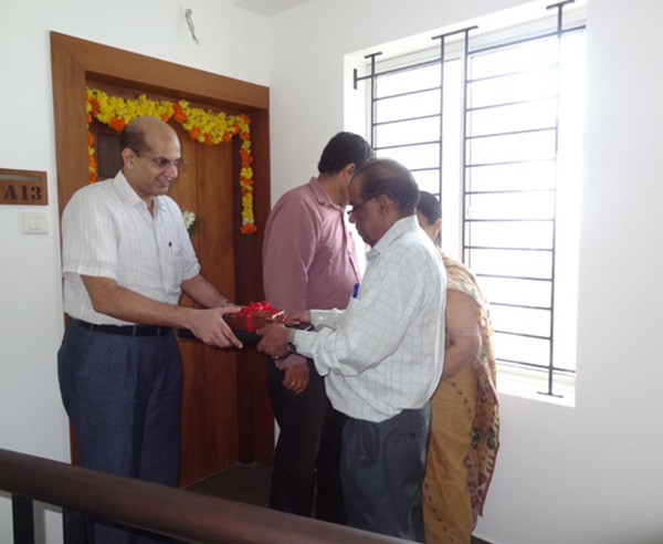 Keys being handed over to Dr. Santhakumar of apartment no. A 13 