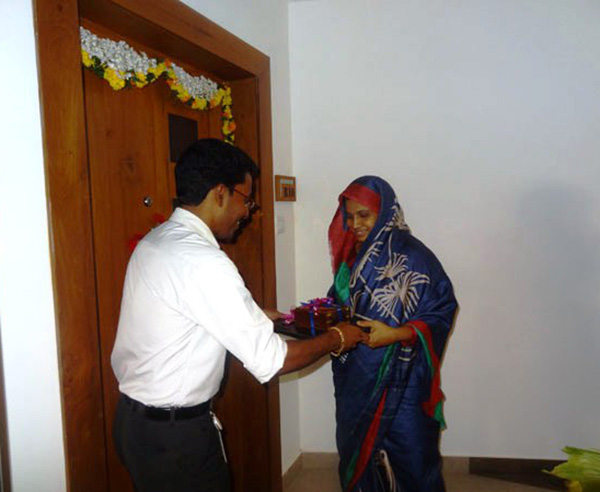 Keys being handed over to Mr. Yoonus Salim of apartment no. B 10