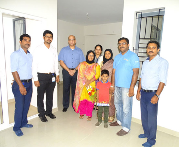 Our team with Ms. Katheeja & family of apartment A 1 in Crescent Aster after handing over.