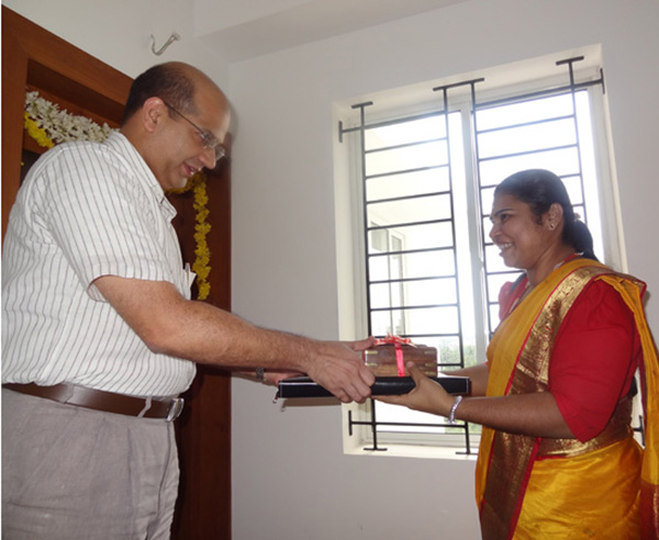 Keys being handed over to Ms. Sherly.P of apartment no. A 9 