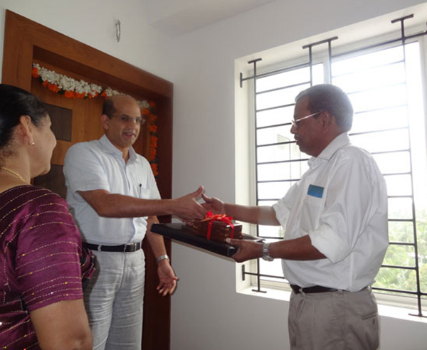 Keys being handed over to Mr. Cyriac of apartment no.A 8 