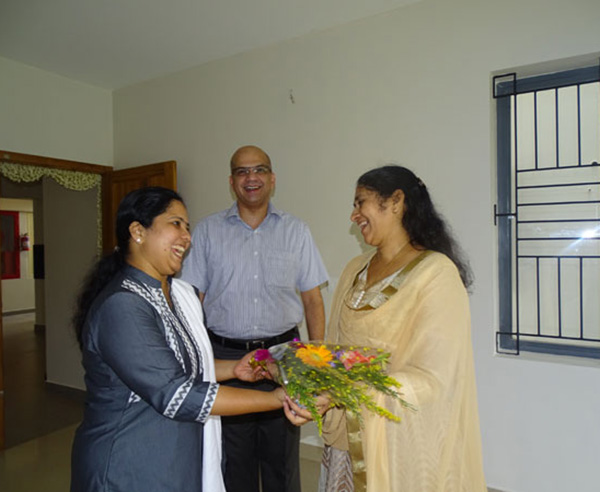 Our Relationship Officer greeting Ms. Asha Nair of apartment B 9 in Crescent Aster during handing over ceremony.