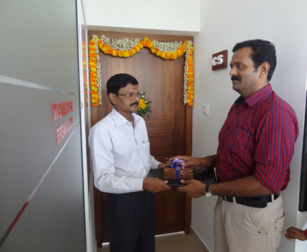 Keys being handed over to Mr. M G Rameshan, apartment no C 5