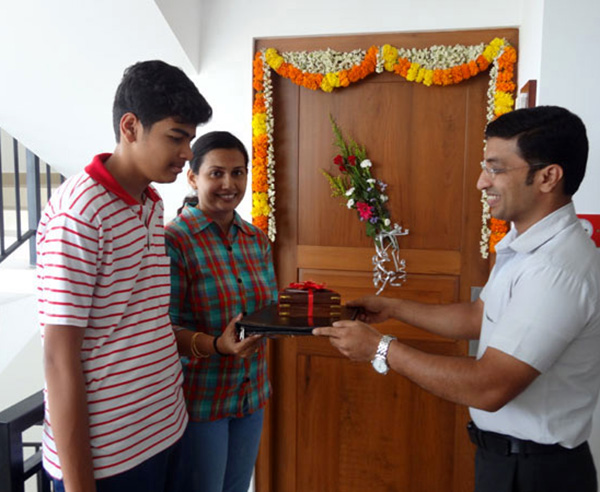 Keys being handed over to Mrs. Reena Balakrishnan, apartment B 7