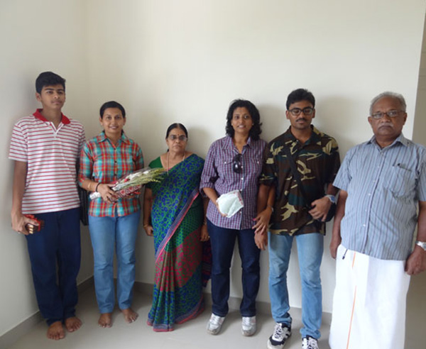 Ms. Reena Balakrishnan & family , of apartment no B 7 in Crescent Mansa during handing over ceremony