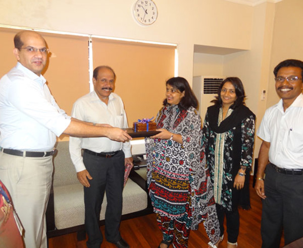 Keys being handed over to Ms. Sheeba Rashid, apartment no. A 5.