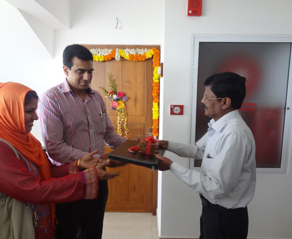 Keys being handed over to Mr. & Mrs. Bava Usman  of apartment no B 11