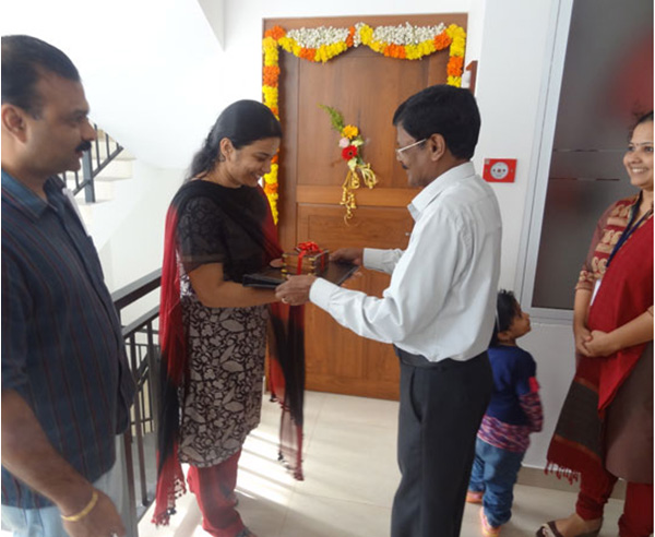 Keys being handed over to Ms. Janitha of apartment no B 2