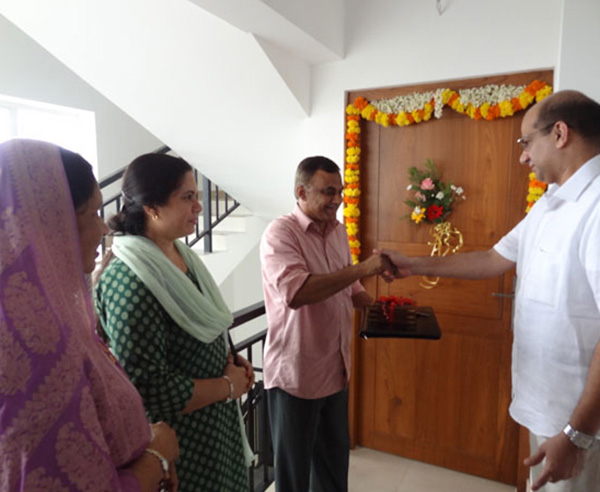 Keys being handed over to Mr. Jaleel  of apartment no B 10