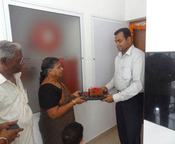 Keys being handed over to Mrs. Shashikala (member Malabar Devasom Board)  of apartment no C 2