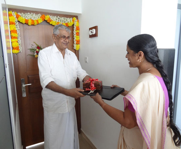 Keys being handed over to Ms. Sindhuja S of apartment no C 9