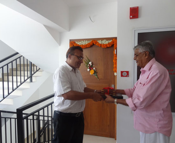 Keys being handed over to Mr. Azeez  of apartment no B 4