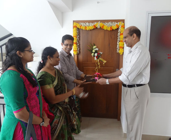 Keys being handed over to Mr. & Mrs. K V Muraleedharan  of apartment no B 3