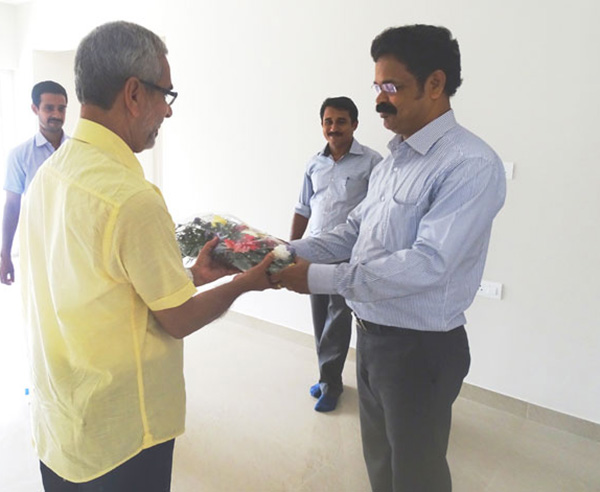 Our Asst. Manager - Administration greeting Mr.Mohammed Iqbal of apartment D 2, Crescent Aster during handing over ceremony.