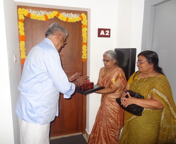 Keys being handed over to Ms. Lathika of apartment A 2