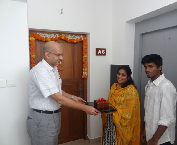 Keys being handed over to Ms. Sheeja Ajai of apartment A 6