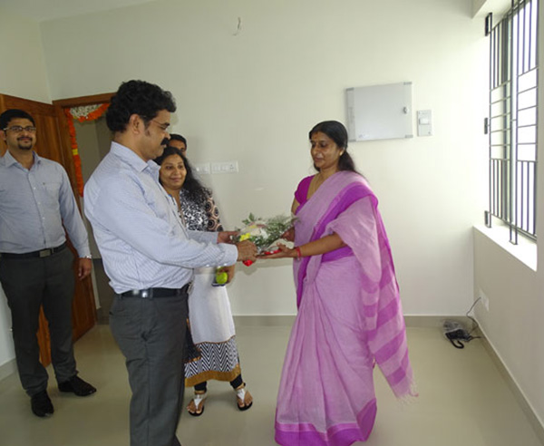 Our Administration Manager greeting Ms. Pushpalatha Rajan of apartment D 13 in Crescent Aster during handing over ceremony.