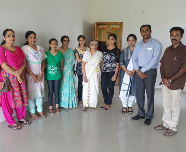 Our GM - Sales & Marketing Savin Monu and Relationship Officer Padmaja Rao with Ms. Kavya  & family of apartment D 12 in Crescent Aster after handing over