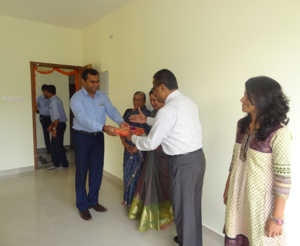 Our G M Sales & Marketing greeting Mr.Krishnan Kutty Nair of apartment D 6,Crescent Iris during handing over ceremony.	