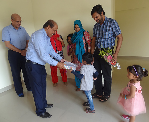 Our G M Administration greeting Dr.Ahammed Naseem of apartment A 4, Crescent Iris during handing over ceremony.