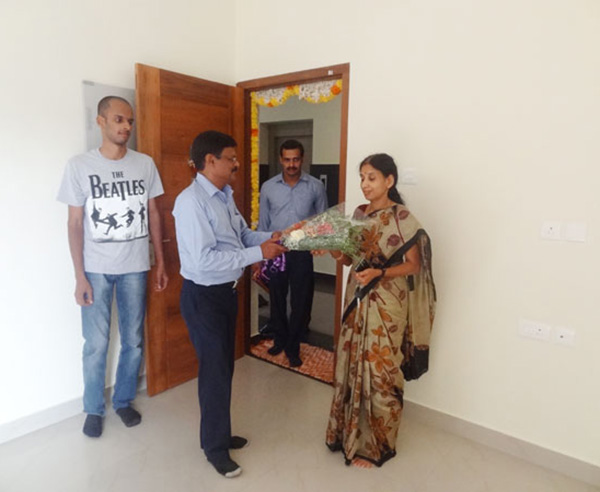 Our G M Projects greeting Ms.Vinaya of apartment B 3, Crescent Iris during handing over ceremony.