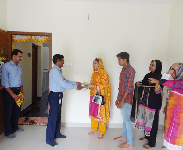 Our G M Projects greeting Ms.Shareena of apartment A 2, Crescent Iris during handing over ceremony.