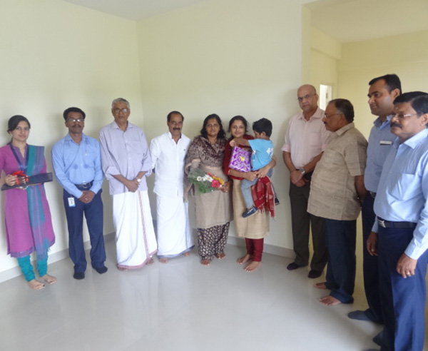 Mr.Kurian Abraham & family, of apartment A 8 in Crescent Iris during handing over ceremony. 