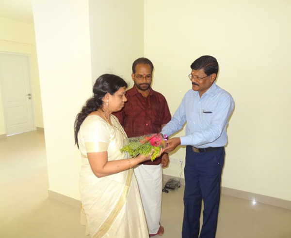 Our G M Projects greeting Ms.Remani of apartment C 6,Crescent Iris during handing over ceremony.