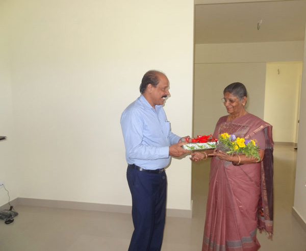 Our G M Administration greeting Ms.Prema Gangadhar of apartment A 5, Crescent Iris during handing over ceremony.