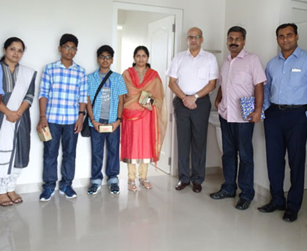 Our team with Mr. Sabiraj Gangadharan of apartment C 7 in Crescent Aster after handing over