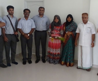 Our team with Ms. Asma V P and family of apartment C 5 in Crescent Tulip after handing over