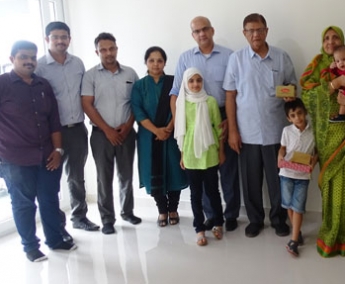 Our team with Ms. Naseem and family of apartment A 7 in Crescent Tulip after handing over