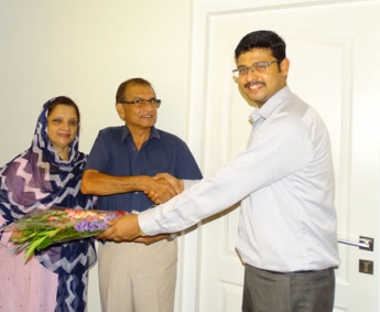 Our AGM Projects - Jeswint Clement greeting Mr. & Mrs. K V Basheer Ahamed of apartment C 2 in Crescent Tulip during handing over ceremony.