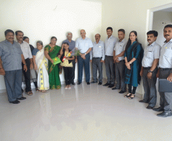 Our team with Ms.Latha P.K & family of apartment no. C 5 in Crescent Zinnia after handing over.