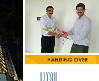 Our AGM Projects - Jeswint Clement greeting Mr. Vinod Kumar K. of apartment C 12 in Platinum Crescent during handing over ceremony.