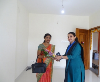 Our G M Sales & Marketing - Fathima Shafi greeting Ms. Aswathy.V.Nair of apartment no. A 3 in Crescent Zinnia during handing over ceremony.