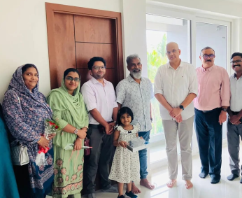 Our team with Dr. Rashid C.P and family of apartment No. D 04 in Triton Crescent ,after handing over