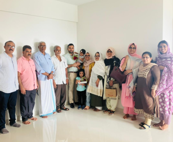 Our team with Dr. Shamnad and family of apartment No. A 14 in Triton Crescent ,after handing over