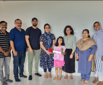 Our team with Ms. Bajeena and family of apartment No. D 15 in Triton Crescent ,after handing over