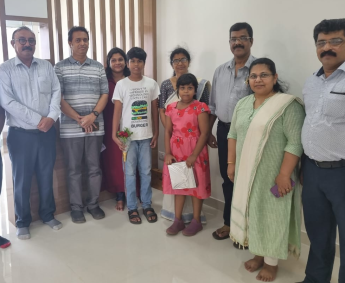 Our team with Dr. Rose Kunnath and family of apartment No. B 18 in Triton Crescent ,after handing over