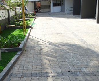 shows yard interlock work completed on the south side