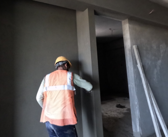 Shows internal wall plastering work is in progress on 4th floor.