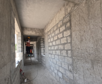 Shows terrace floor lobby masonry work has been completed.