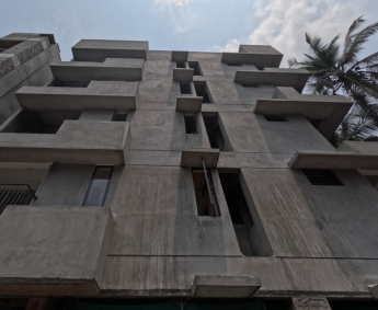   External plastering work is in progress on south side of the building.