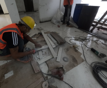 Apartment floor tiling work is in progress in an apartment on 1st floor.